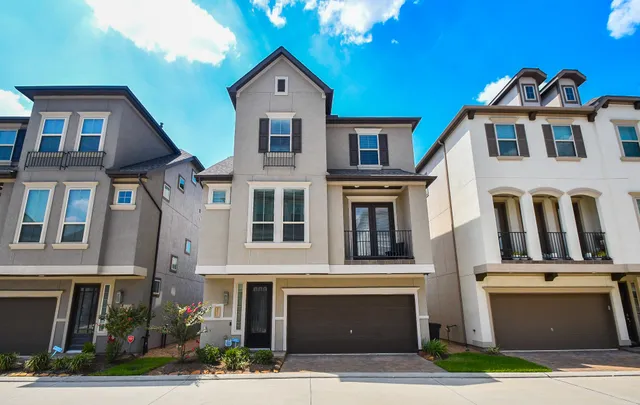 a view of a big yard in front of a brick building