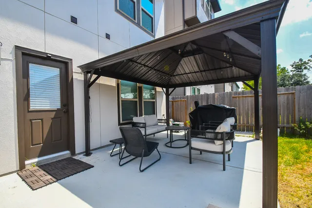 a view of hall way with furniture and wooden floor