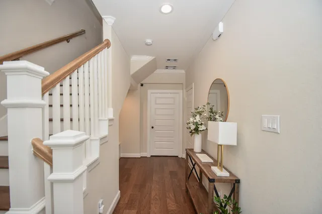 a view of an entryway with wooden floor