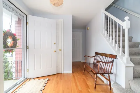 a view of a livingroom with furniture and staircase