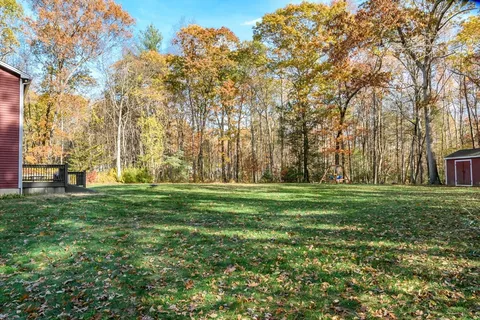 an aerial view of a houses with outdoor space