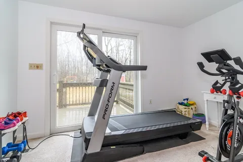 a bedroom with furniture and a window