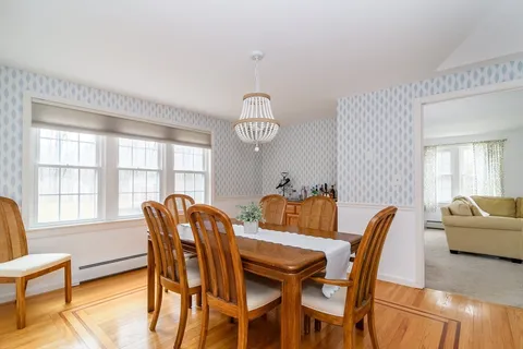 a view of a dining room with furniture window and outside view