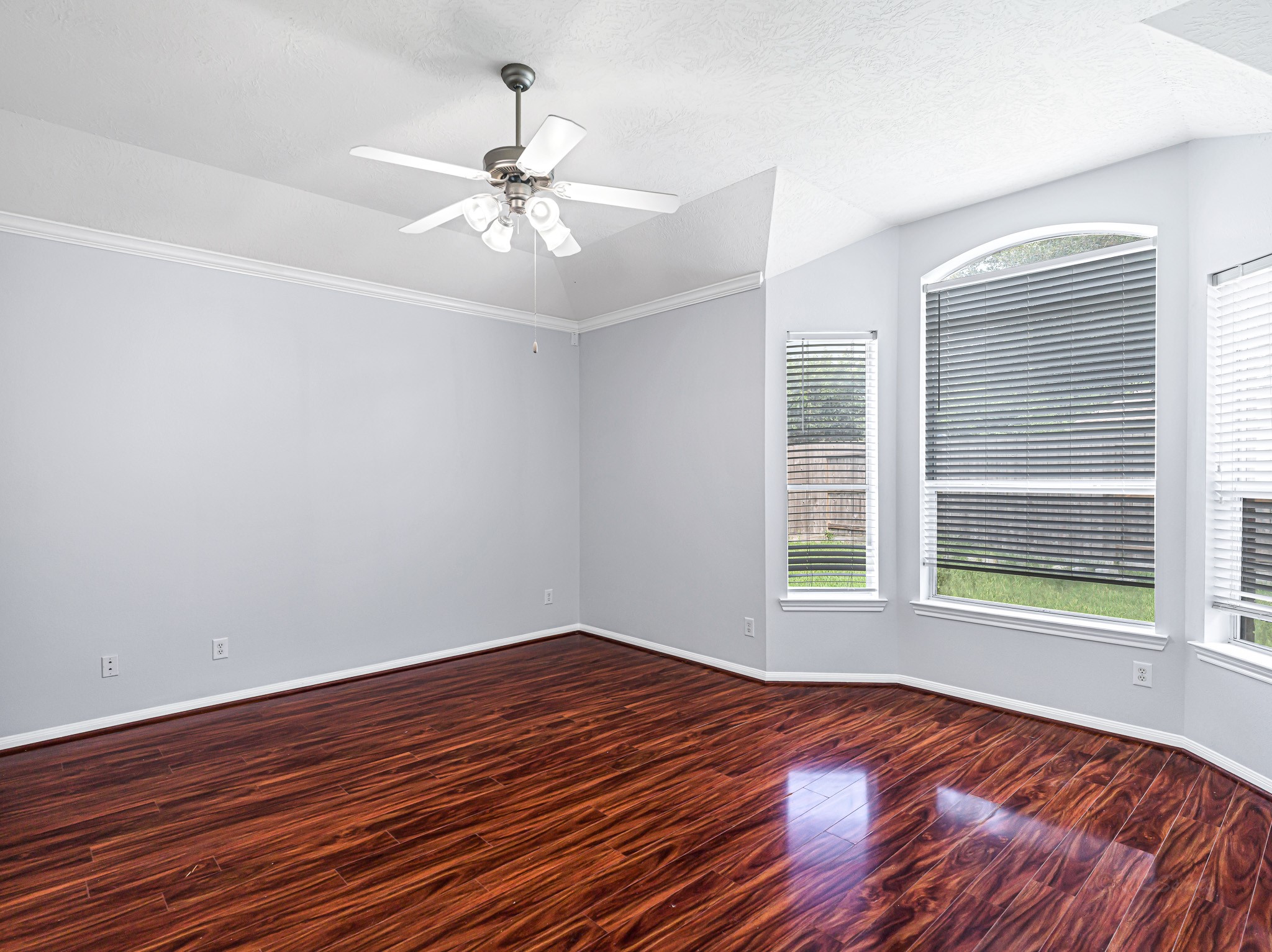 25203 Auburn Terrace Drive Spring, TX 77389 - Photo 12 of 21 a view of an empty room with wooden floor and a window