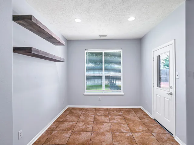 an empty room with windows