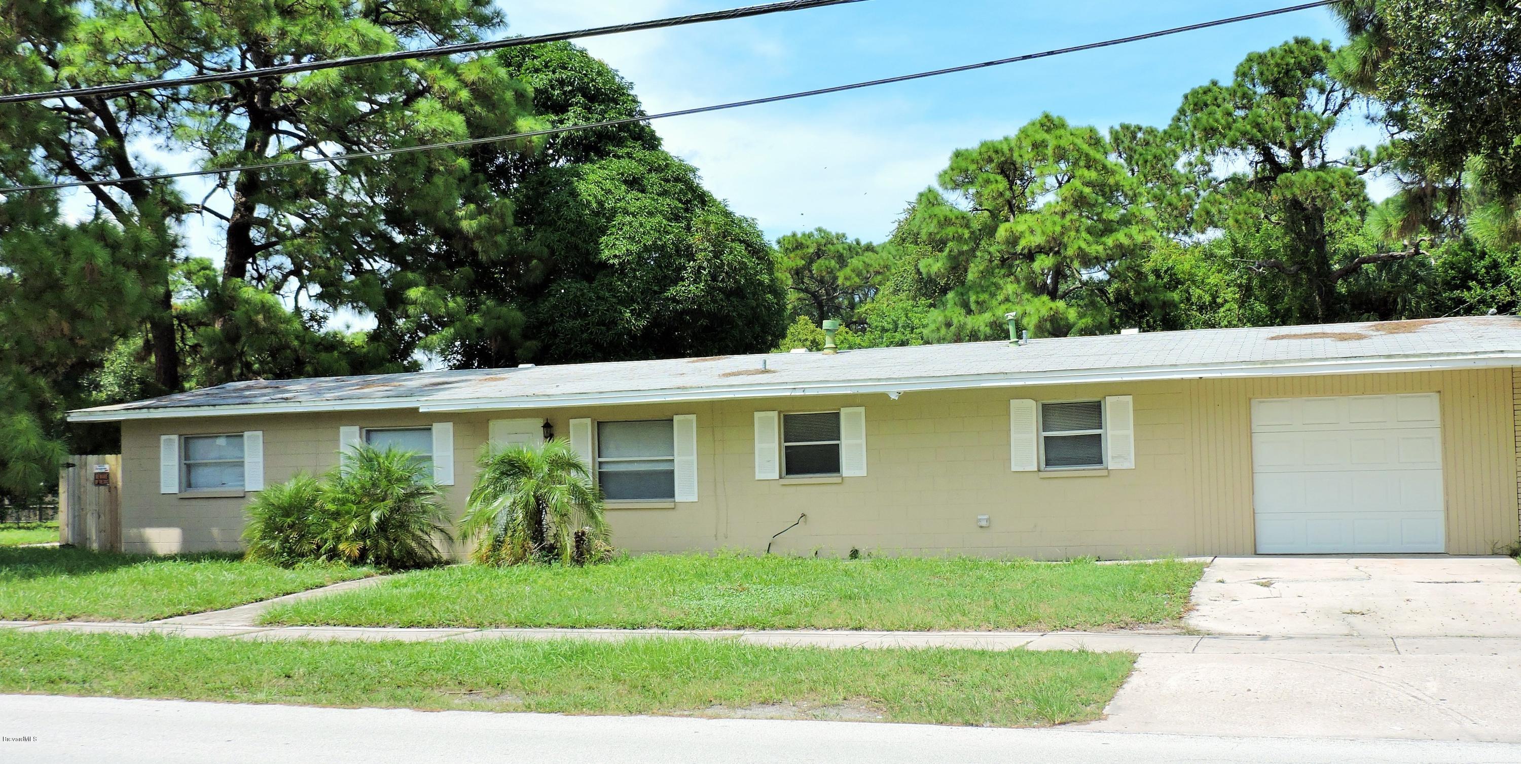 1044 Holmes Street Cocoa, FL 32922 - Photo 2 of 5 a view front of house with a yard