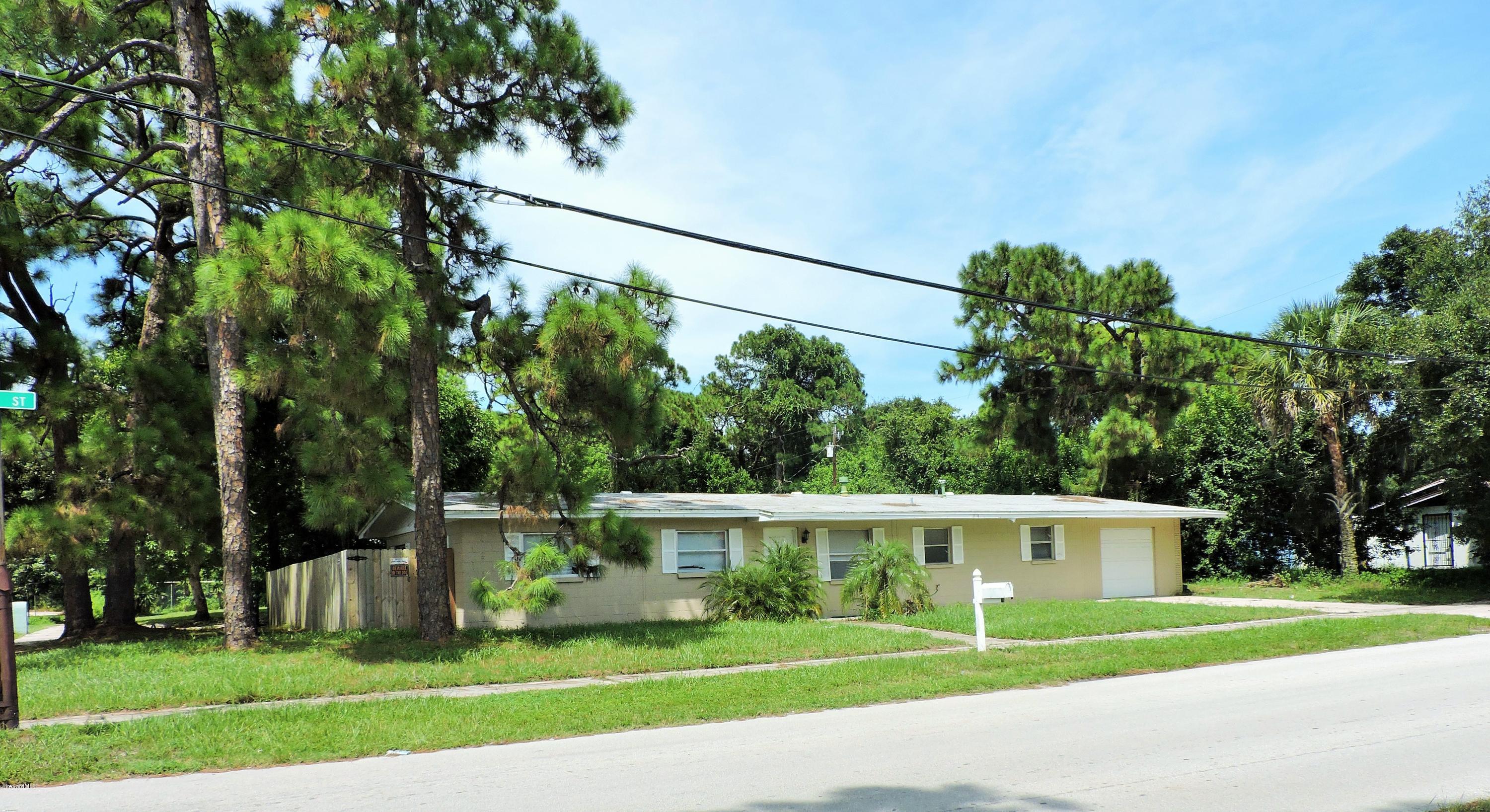 1044 Holmes Street Cocoa, FL 32922 - Photo 3 of 5 a view of a house with a yard