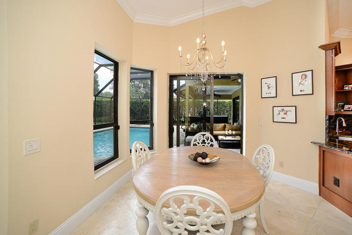 5686 St Annes Way Boca Raton, FL 33496 - Photo 8 of 18 a view of a dining room with furniture and chandelier