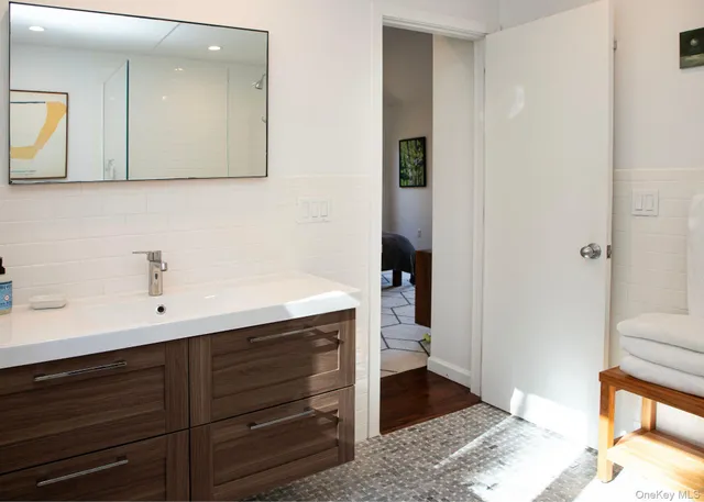 a bathroom with a sink and a mirror