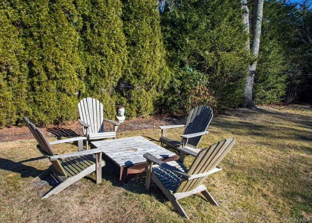 a view of a patio with table and chairs and wooden floor