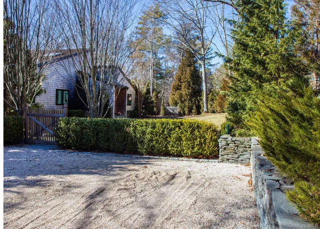 a view of a pathway both side of house