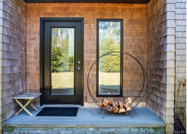 a view of a room with wooden floor and a window