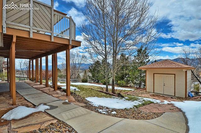 12208 Stanley Canyon Road Colorado Springs, CO 80921 - Photo 25 of 27 Backyard with well-made tool shed. There are also steps from the north side of garage to access this area.