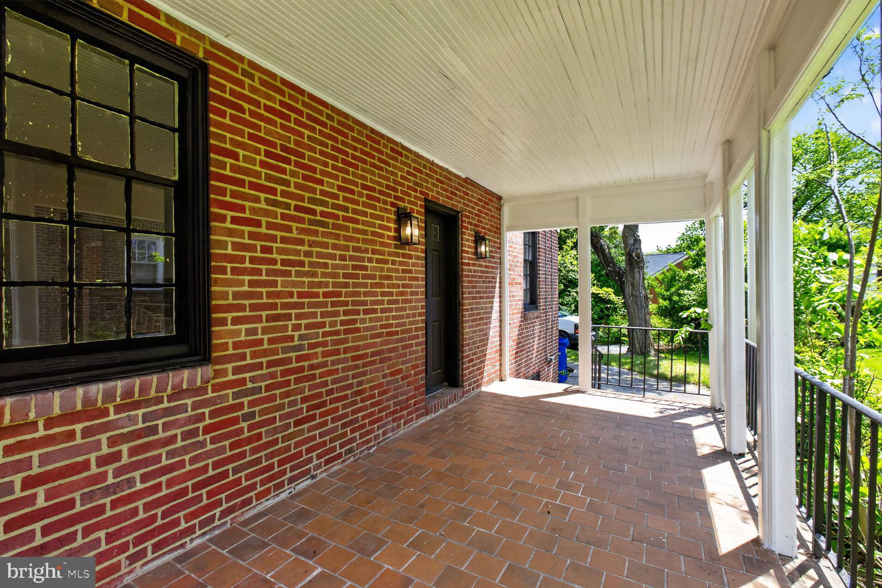 315 East Cold Spring Lane Baltimore, MD 21212 - Photo 7 of 25 a view of a house with porch and wooden floor