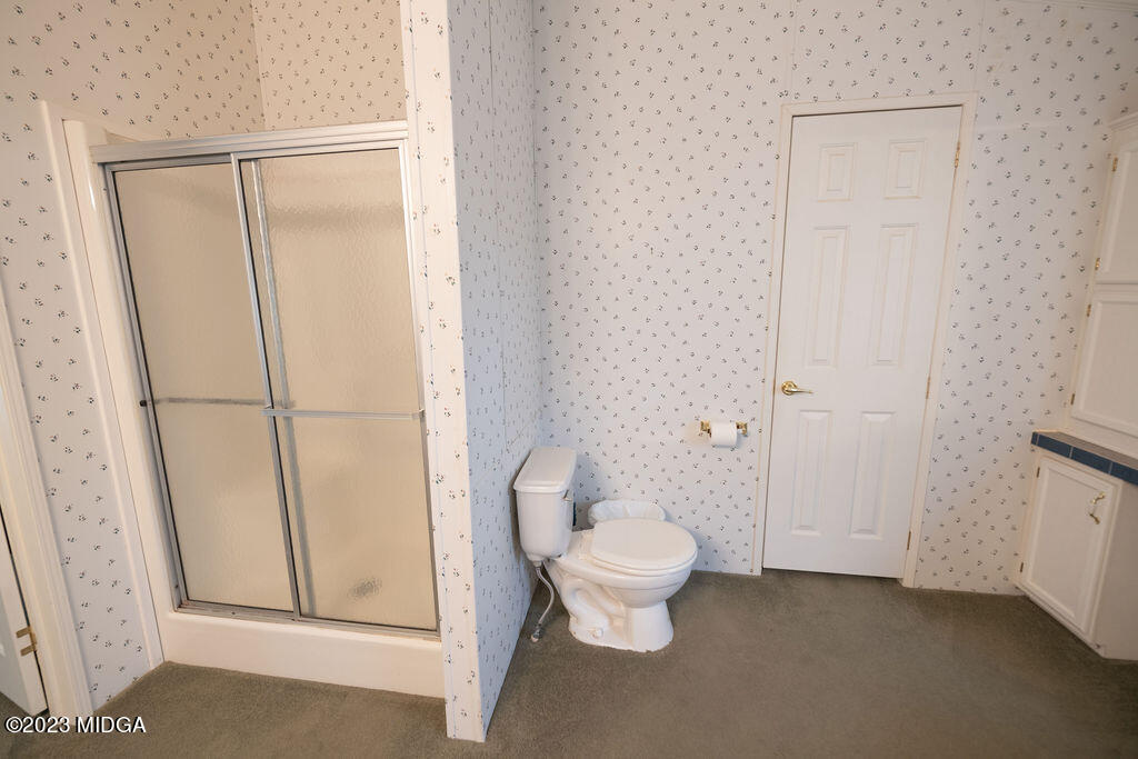 5933 Moseley Dixon Road Macon, GA 31220 - Photo 16 of 38 a bathroom with a toilet and a shower