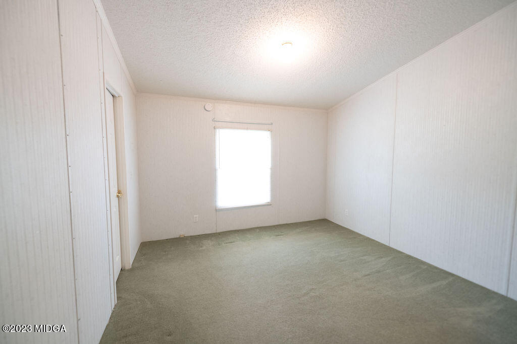 5933 Moseley Dixon Road Macon, GA 31220 - Photo 18 of 38 an empty room with a window