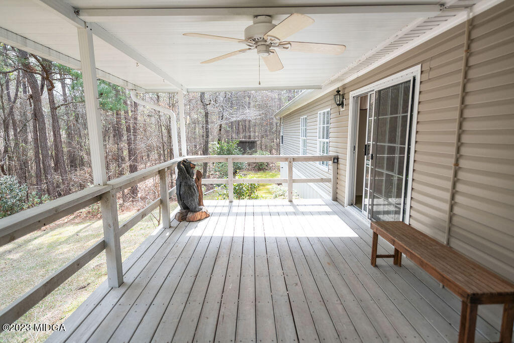 5933 Moseley Dixon Road Macon, GA 31220 - Photo 23 of 38 a view of balcony with wooden floor and furniture