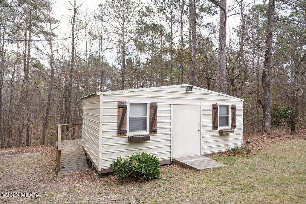 5933 Moseley Dixon Road Macon, GA 31220 - Photo 26 of 38 a front view of a house with a yard