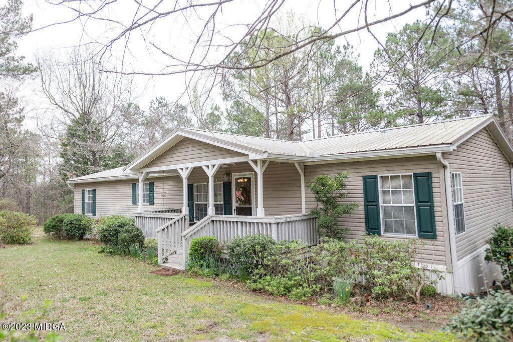 5933 Moseley Dixon Road Macon, GA 31220 - Photo 3 of 38 front view of a house with a yard