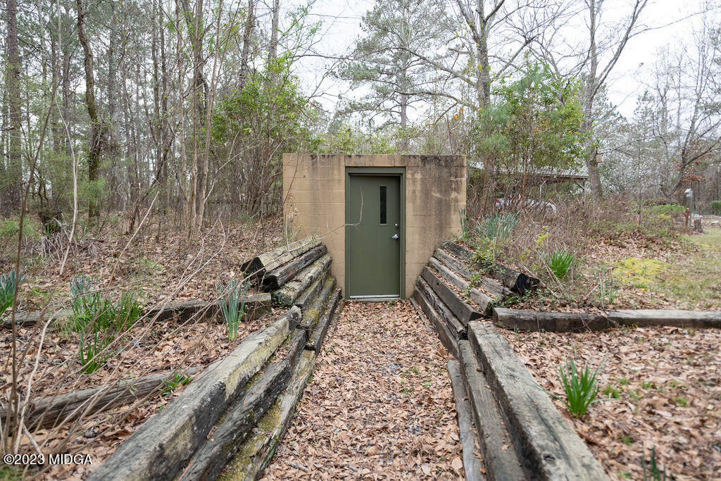 5933 Moseley Dixon Road Macon, GA 31220 - Photo 32 of 38 a house with trees in front of it