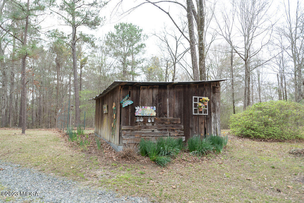 5933 Moseley Dixon Road Macon, GA 31220 - Photo 34 of 38 a front view of a house with garden