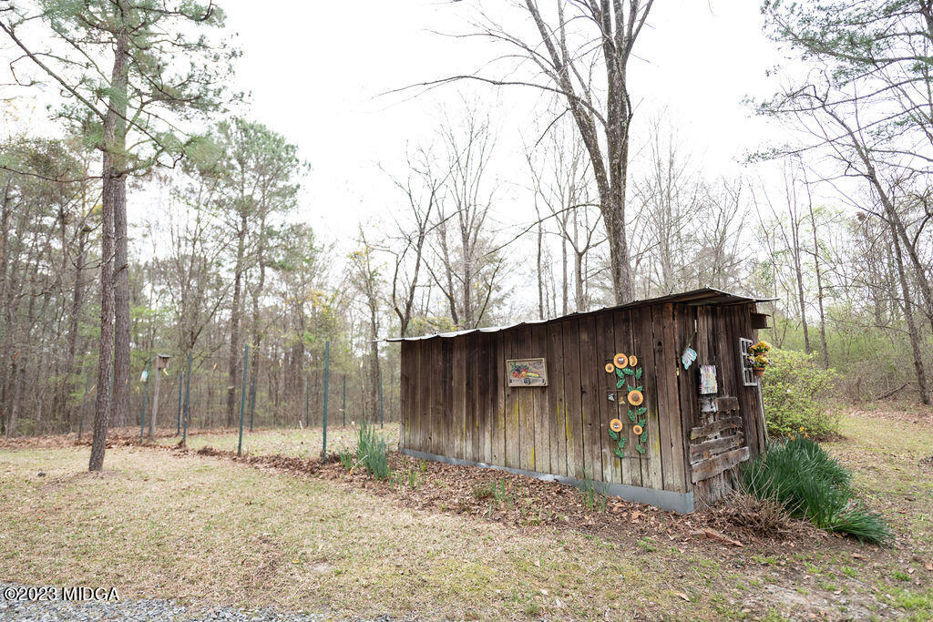 5933 Moseley Dixon Road Macon, GA 31220 - Photo 35 of 38 a front view of a house with a yard and garage