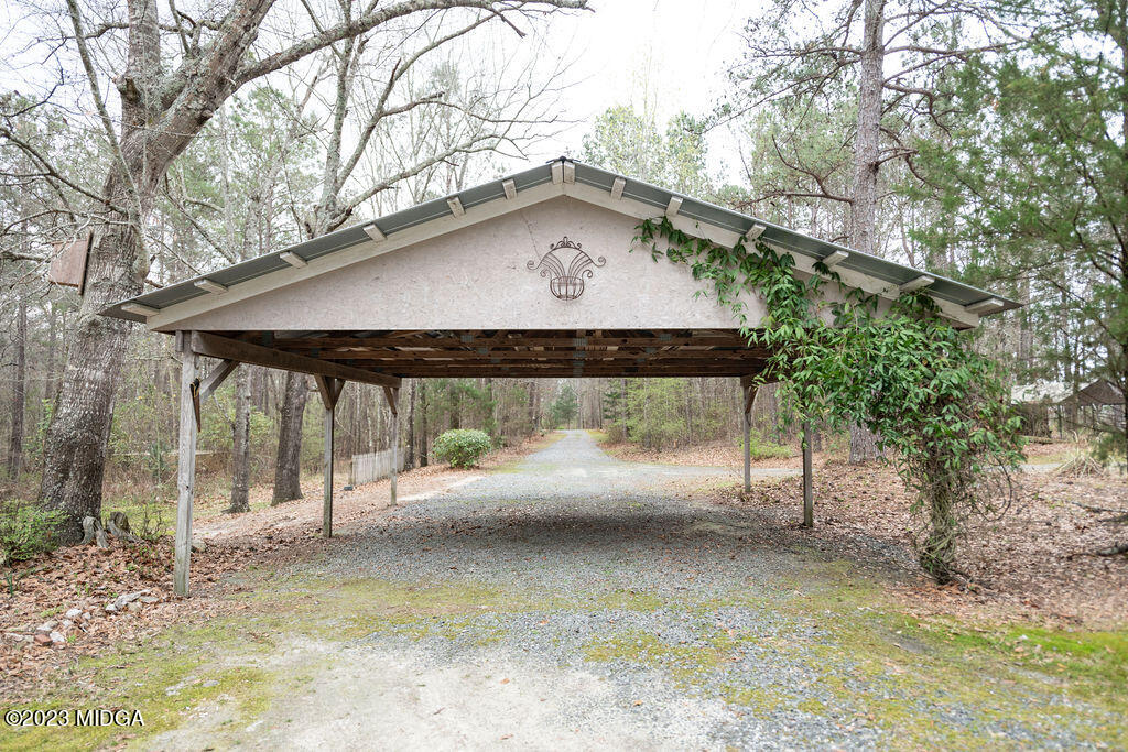 5933 Moseley Dixon Road Macon, GA 31220 - Photo 4 of 38 a view of a house with a yard and wooden fence