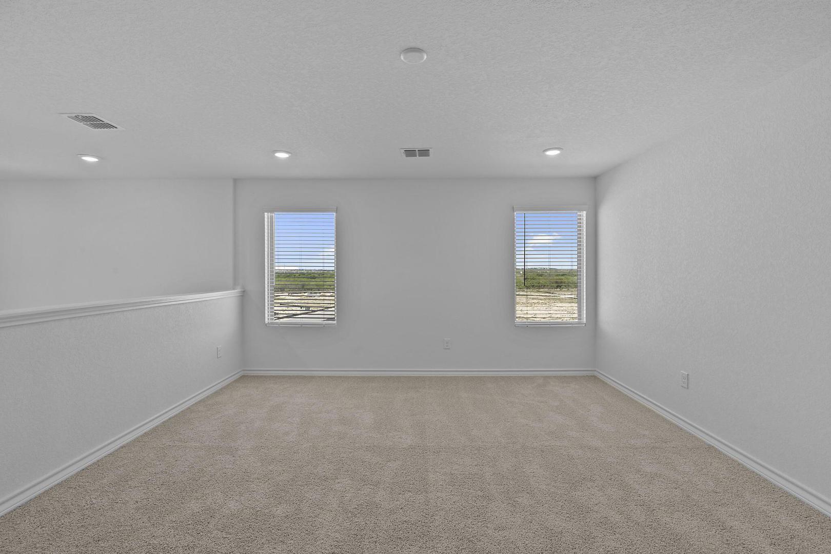 109 Hatari Trail Jarrell, TX 76537 - Photo 28 of 31 A versatile open-concept space featuring recessed lighting and bright windows.