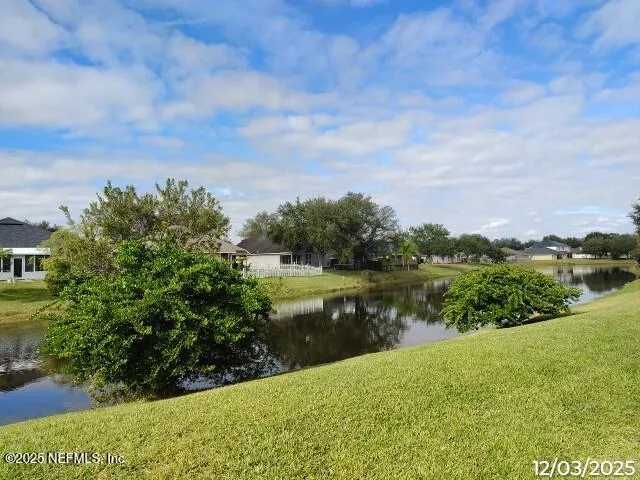 a view of a lake with a yard