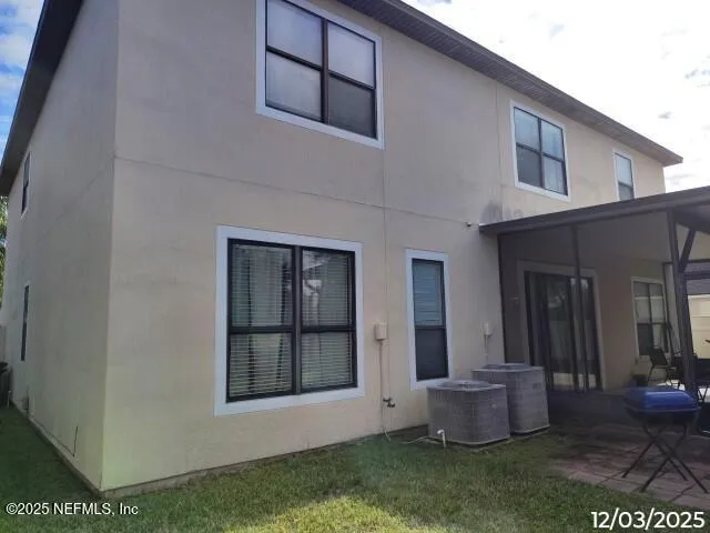 a backyard of a house with yard and barbeque oven