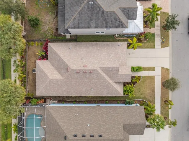 a view of a water with boats and trees in the background