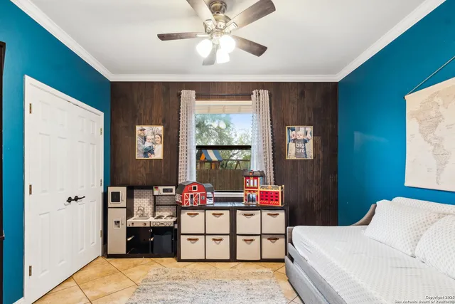 a bedroom with furniture and a window