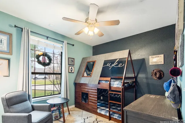 a bedroom with furniture and a window
