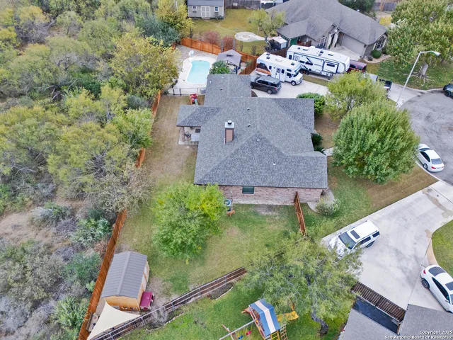 an aerial view of a house with outdoor space
