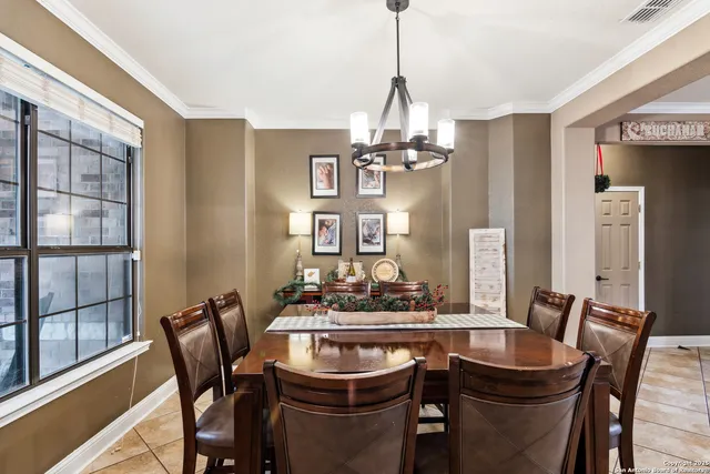 a dining room with furniture and window