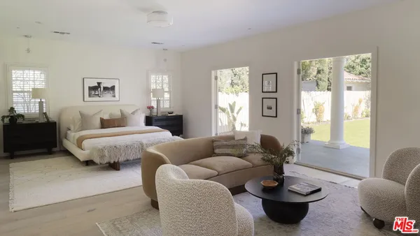 a bedroom with furniture and windows