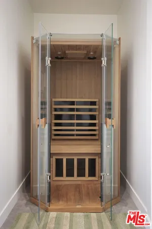 a bedroom with bed and a window