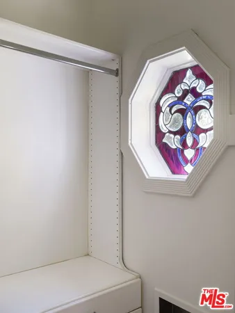 a bathroom with a sink a mirror and a window