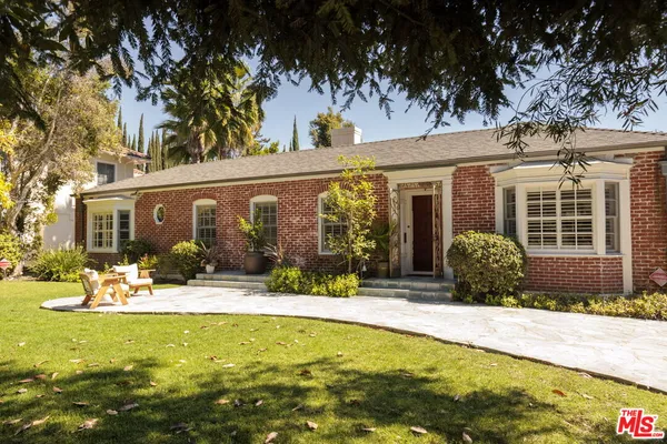 front view of a house with a swimming pool