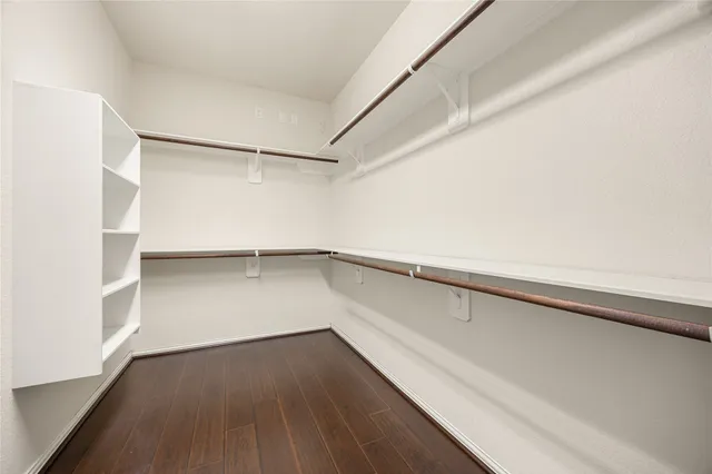 a view of an empty walk in closet