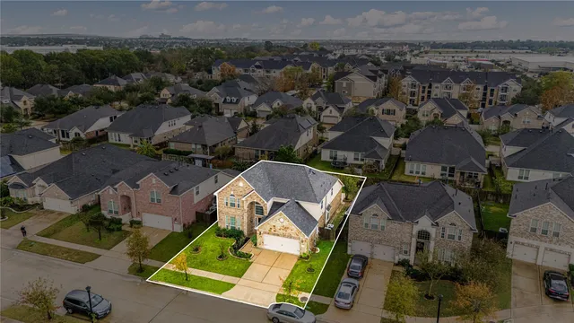 an aerial view of a house with a garden
