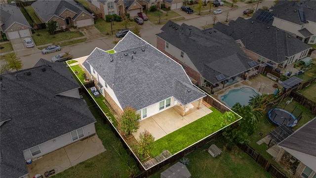an aerial view of an house with a yard