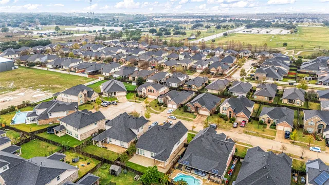an aerial view of residential houses with outdoor space