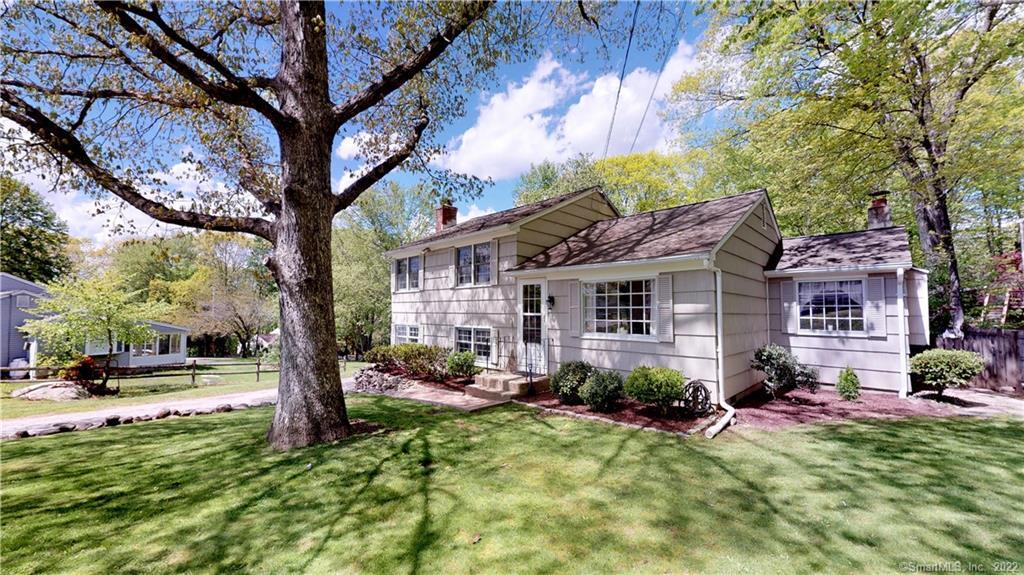 6 Fresh Meadow Road Monroe, CT 06468 - Photo 1 of 1 a front view of a house with garden and trees