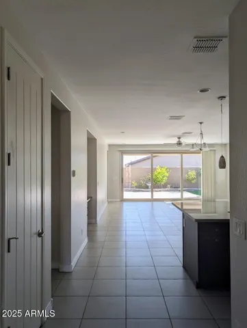 a view of a kitchen with a sink and cabinets