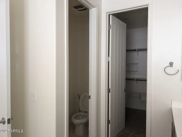 a view of a bathroom from a hallway