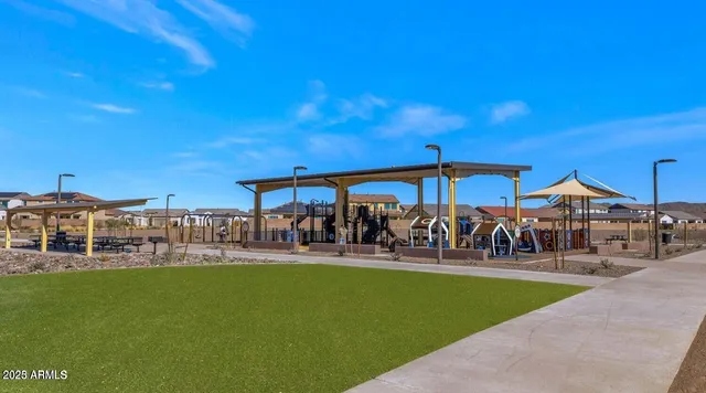 a view of a swimming pool with outdoor seating