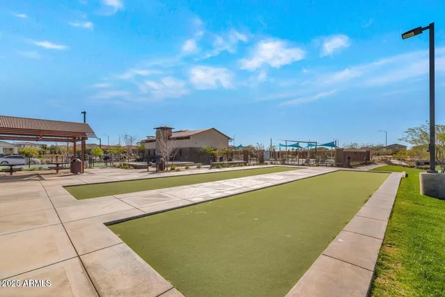 a view of swimming pool with furniture