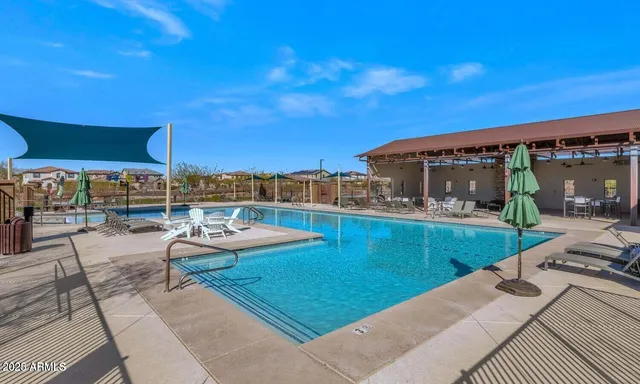 a view of a swimming pool with a patio