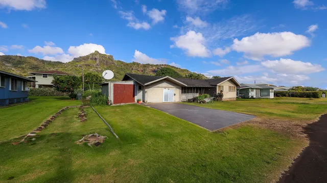 a aerial view of a house with a big yard